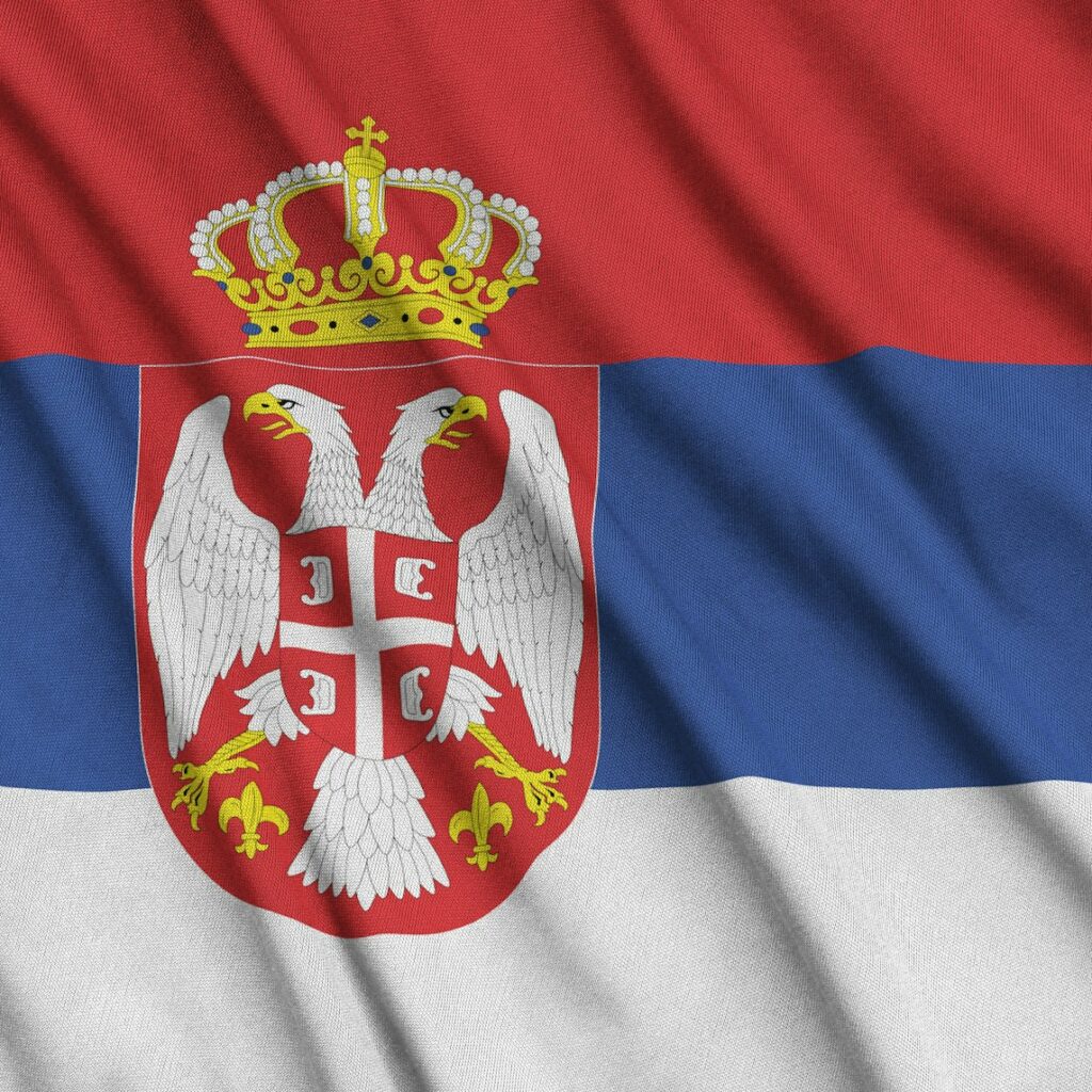 Serbia flag is depicted on a sports cloth fabric with many folds. Sport team waving banner